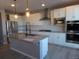 Modern kitchen with white cabinets, granite countertops, and stainless steel appliances at 1153 Elbridge Dr, Elizabeth, CO 80107
