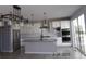 Modern kitchen boasts stainless steel appliances, a large center island with counter seating, and ample cabinet space at 1153 Elbridge Dr, Elizabeth, CO 80107