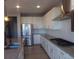 Modern kitchen with white cabinets, stainless steel appliances and granite countertops at 1153 Elbridge Dr, Elizabeth, CO 80107