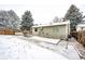 Wide backyard with patio, surrounded by privacy fence and mature trees at 4274 S Fundy Way, Aurora, CO 80013