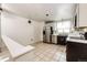 Kitchen features modern stainless steel appliances, white cabinets, and tile flooring at 4274 S Fundy Way, Aurora, CO 80013