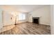 Well-lit living room with a cozy fireplace and attractive flooring at 4274 S Fundy Way, Aurora, CO 80013