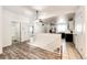 Bright living space connects to the kitchen via a white railing at 4274 S Fundy Way, Aurora, CO 80013