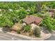 Home's roof and driveway, with surrounding greenery and mature trees at 797 W Briarwood Ave, Littleton, CO 80120