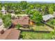 View of the house with deck, yard and surrounding landscape and mature trees at 797 W Briarwood Ave, Littleton, CO 80120