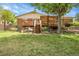 Back of house with deck, stairs and stone landscaping at 797 W Briarwood Ave, Littleton, CO 80120