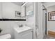 Classic black-and-white tiled bathroom with modern fixtures and ample lighting at 797 W Briarwood Ave, Littleton, CO 80120