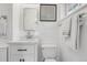Bathroom featuring white marble countertop, modern fixtures, and ample storage at 797 W Briarwood Ave, Littleton, CO 80120