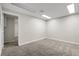 The bedroom has neutral paint, new carpet and a doorway to an additional room at 797 W Briarwood Ave, Littleton, CO 80120
