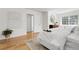 Sun-filled bedroom featuring hardwood floors, white walls, and neutral decor at 797 W Briarwood Ave, Littleton, CO 80120