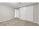 The carpeted bedroom has ample closet space at 797 W Briarwood Ave, Littleton, CO 80120
