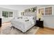 Bright bedroom with large windows, hardwood floors, and stylish decor at 797 W Briarwood Ave, Littleton, CO 80120