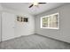 Bright bedroom with neutral carpet and windows providing ample natural light at 797 W Briarwood Ave, Littleton, CO 80120