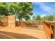 Large wood deck with wood railing, the perfect place for outdoor dining at 797 W Briarwood Ave, Littleton, CO 80120