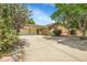 Charming single-story brick home with a spacious driveway and a two-car garage at 797 W Briarwood Ave, Littleton, CO 80120