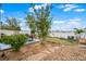 Landscaped backyard featuring a grass lawn, patio with seating, and privacy fence at 20414 E 55Th Pl, Denver, CO 80249