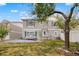 Backyard with mature trees, green grass, patio area with seating at 20414 E 55Th Pl, Denver, CO 80249