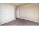 Bedroom featuring neutral paint, carpet, walk in closet, and passage door to other rooms at 20414 E 55Th Pl, Denver, CO 80249