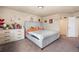 Bedroom with dresser, bed, walk-in closet and decor at 20414 E 55Th Pl, Denver, CO 80249