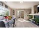 Bright dining area with a marble table, natural light, and a sliding glass door for indoor/outdoor living at 20414 E 55Th Pl, Denver, CO 80249