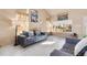Comfortable living room with stylish furniture, bright decor, and large windows filling the space with natural light at 20414 E 55Th Pl, Denver, CO 80249