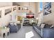 Bright, open living room with a soaring ceiling, fireplace, neutral décor, and ample natural light at 20414 E 55Th Pl, Denver, CO 80249