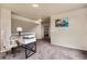 Loft area with a desk and view into another room featuring neutral color scheme and carpeting at 20414 E 55Th Pl, Denver, CO 80249