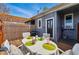 Cozy back patio with wood deck, barbecue grill, and outdoor table and chairs at 2955 N Columbine St, Denver, CO 80205