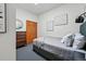 Cozy bedroom with neutral tones, a comfortable bed, and a stylish dresser at 2955 N Columbine St, Denver, CO 80205