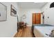 Bedroom featuring stylish decor, hardwood floors, and a comfortable bed at 2955 N Columbine St, Denver, CO 80205