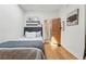 Comfortable bedroom featuring hardwood floors, stylish artwork, and modern lighting at 2955 N Columbine St, Denver, CO 80205