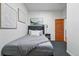 Bedroom features comfortable bed, unique artwork, and a modern lamp at 2955 N Columbine St, Denver, CO 80205