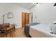 Bedroom features a comfy chair, hardwood floors, and natural light at 2955 N Columbine St, Denver, CO 80205