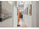 Long hallway with hardwood floors, elegant artwork, and a welcoming atmosphere at 2955 N Columbine St, Denver, CO 80205