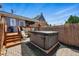 Outdoor hot tub with a privacy fence and a view of the house at 2955 N Columbine St, Denver, CO 80205