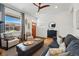 Inviting living room featuring hardwood floors, comfortable seating, and a stylish ceiling fan at 2955 N Columbine St, Denver, CO 80205
