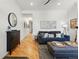 Spacious living room with wood floors, a comfortable sofa, and modern decor at 2955 N Columbine St, Denver, CO 80205