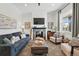 Bright living room featuring a fireplace and neutral decor at 2955 N Columbine St, Denver, CO 80205
