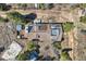 Aerial view highlighting the home's roof, rooftop deck, and surrounding landscape at 33 L Rd, Golden, CO 80403