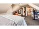 Cozy attic space with unique angles and a glimpse into an adjoining room at 33 L Rd, Golden, CO 80403