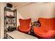 Relaxing attic nook with vibrant seating, shelving, and a cozy atmosphere at 33 L Rd, Golden, CO 80403