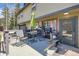 Outdoor deck with seating, table, grill, and door to interior at 33 L Rd, Golden, CO 80403