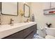 Modern bathroom featuring double sinks, sleek gray cabinetry, and stylish fixtures at 33 L Rd, Golden, CO 80403