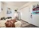 Cozy bedroom featuring hardwood floors, a comfortable bed, and closet at 33 L Rd, Golden, CO 80403
