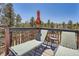 Exterior deck area with lounge chairs and wooded views at 33 L Rd, Golden, CO 80403