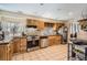 Traditional-style kitchen with oak cabinets, tile backsplash and stainless steel appliances at 33 L Rd, Golden, CO 80403
