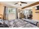 Relax in this primary bedroom with hardwood floors, a ceiling fan, and lots of natural light at 33 L Rd, Golden, CO 80403