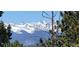 Scenic view of snow-capped mountains through the trees at 33 L Rd, Golden, CO 80403