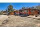 Log-cabin restaurant with an outdoor seating area and parking at 33 L Rd, Golden, CO 80403