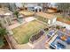 Aerial view of landscaped backyard with play area, shed, waterfall feature, and patio offers an inviting outdoor retreat at 2924 E 116Th Pl, Thornton, CO 80233